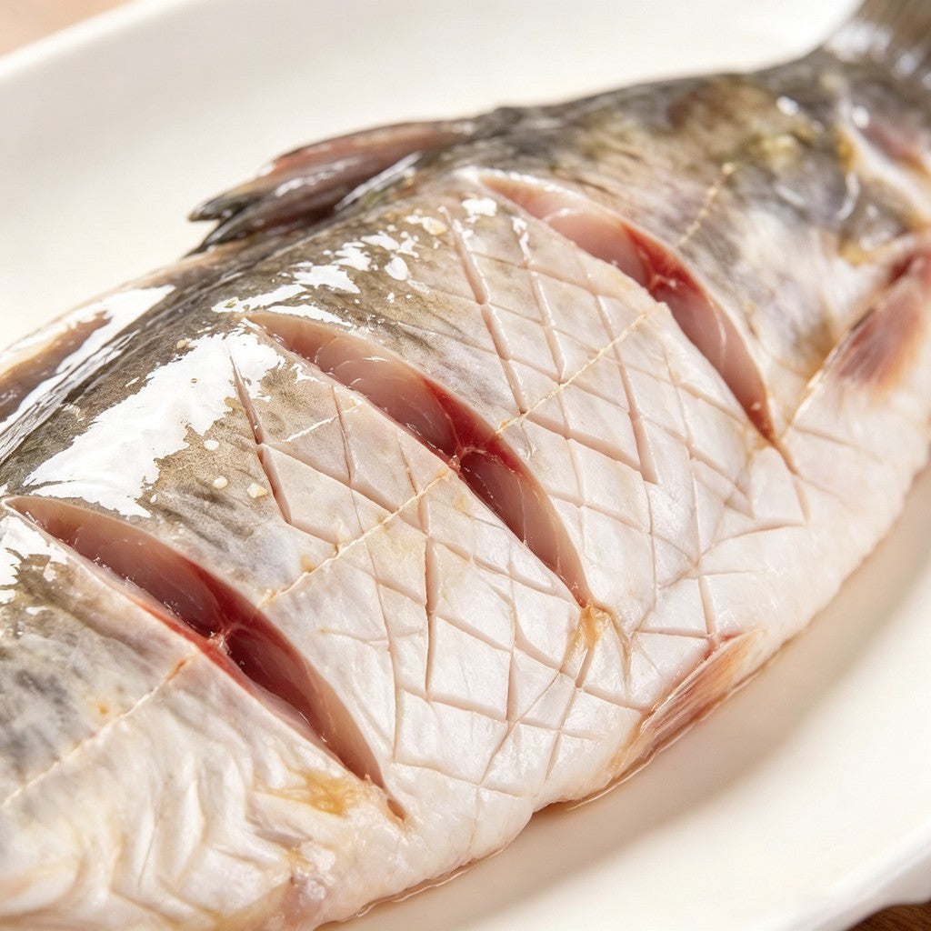 Scored whole carp - view 1